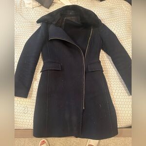 Navy blue coat with black fur collar.